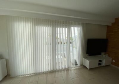 Interior vertical blinds covering a large living room window in Tenerife