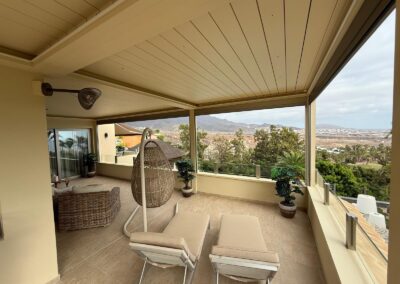 Bioclimatic pergola with a brown finish in an outdoor area
