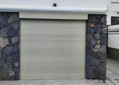 Garage door with a wood-effect finish installed in Tenerife